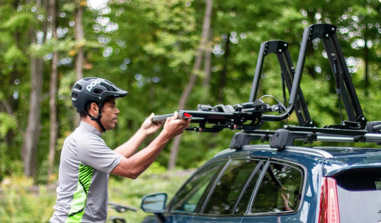 MOS UpLift system on vehicle being pulled down for loading purposes by a cyclist. 