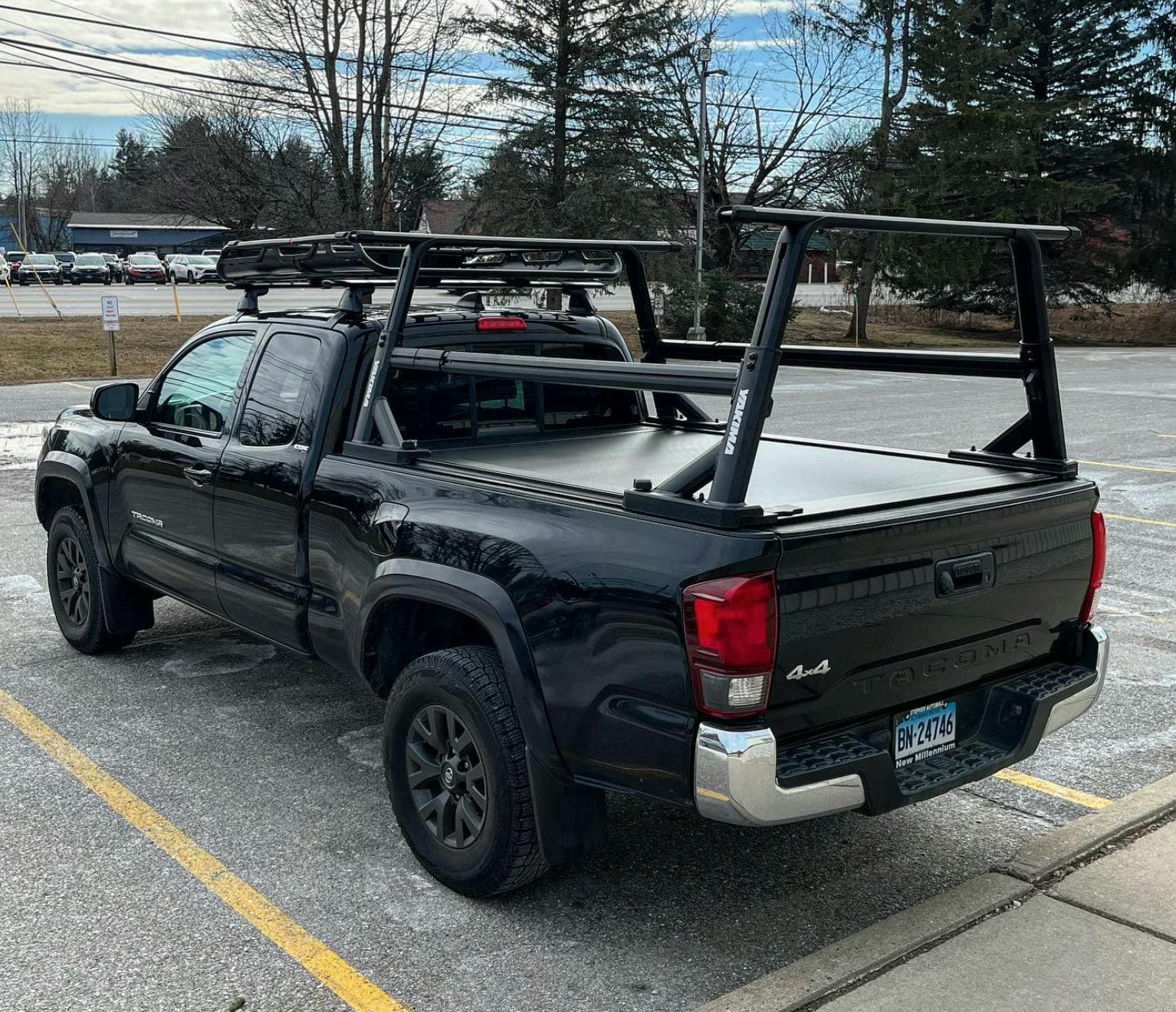 Overhaul Truck Ladder Rack system Installed on bed pf black Tacoma 