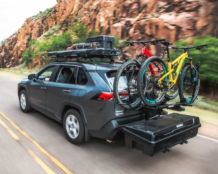 Yakima EXO System: SwingBase, TopShelf, DoubleUp & GearLocker installed on back of loaded SUV loaded with Bikes 