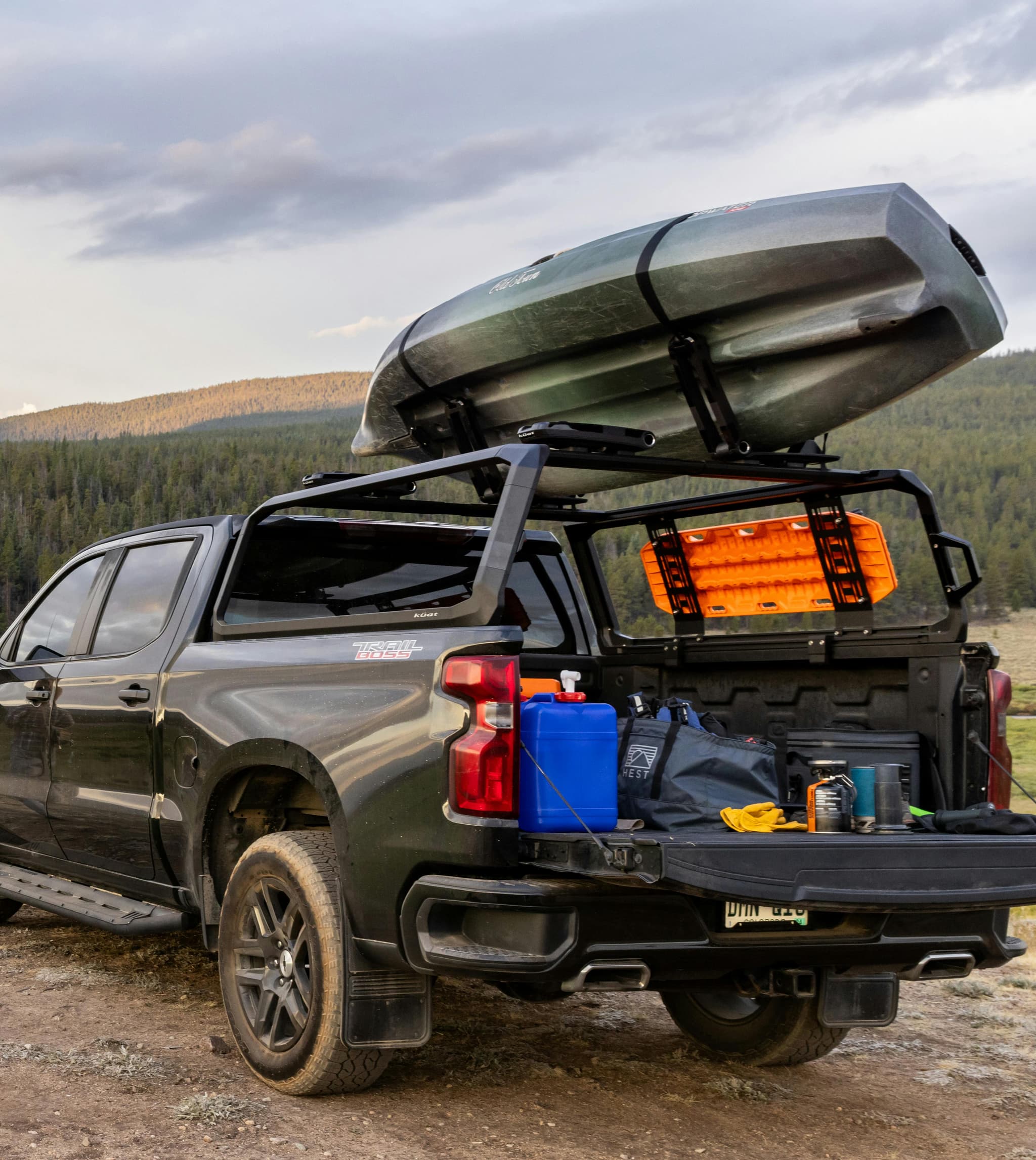 Kuat J-Cradles mounted to the IBEX truck rack system.